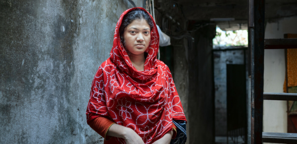Dhaka, Bangladesh: Kakoli* works in a garment factory and barely earns enough to meet her needs. Oxfam's What She Makes campaign demands that big brands pay the women who make our clothes a living wage. Photo: Fabeha Monir/Oxfam. *Name changed to protect identity.